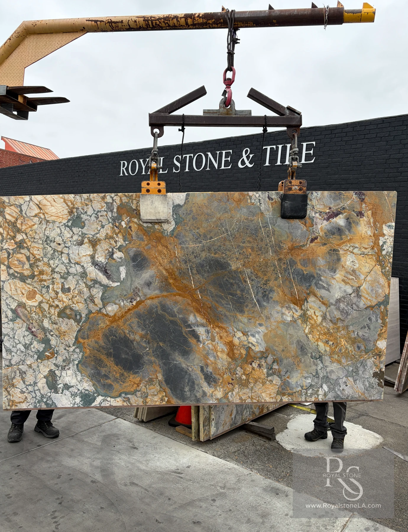2cm Antolini Breche De Vendome Top YG460 honed marble slab, 65 by 126 inches, suspended from the Royal Stone yard crane