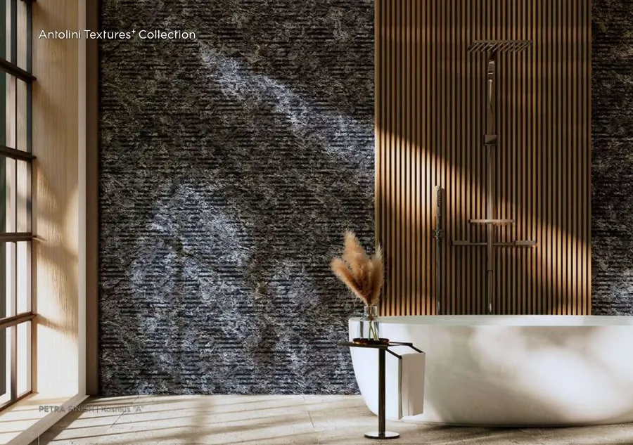 Antolini Kosmus A granite in Petra Finish, charcoal grey with silver and copper passages, bathroom feature wall
