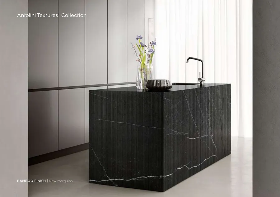 Antolini New Marquina soft quartzite in Bamboo Finish, deep black-grey field with sharp white veining
