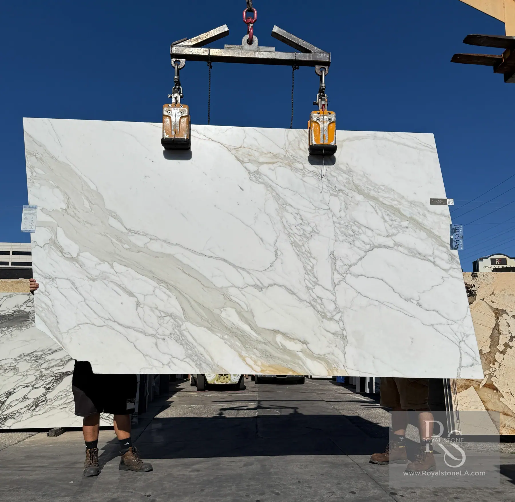 Antolini Calacatta Gold Borghini marble slab with warm gold veining on a white field
