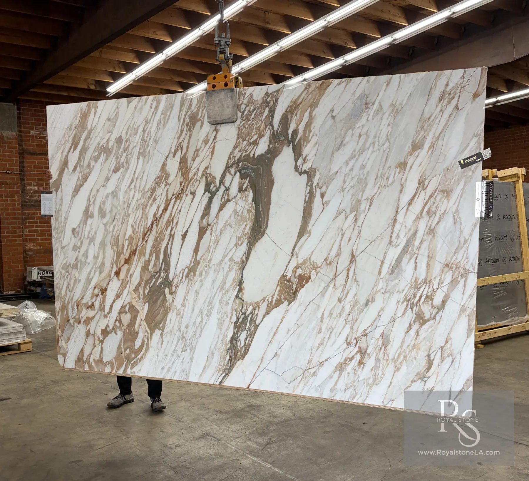2cm Antolini Calacatta Monet Oro Classic marble slab EE505 honed at Royal Stone Los Angeles, chalk-white field with cinnamon, gold, and pale grey-green veining, 78 by 121 inches