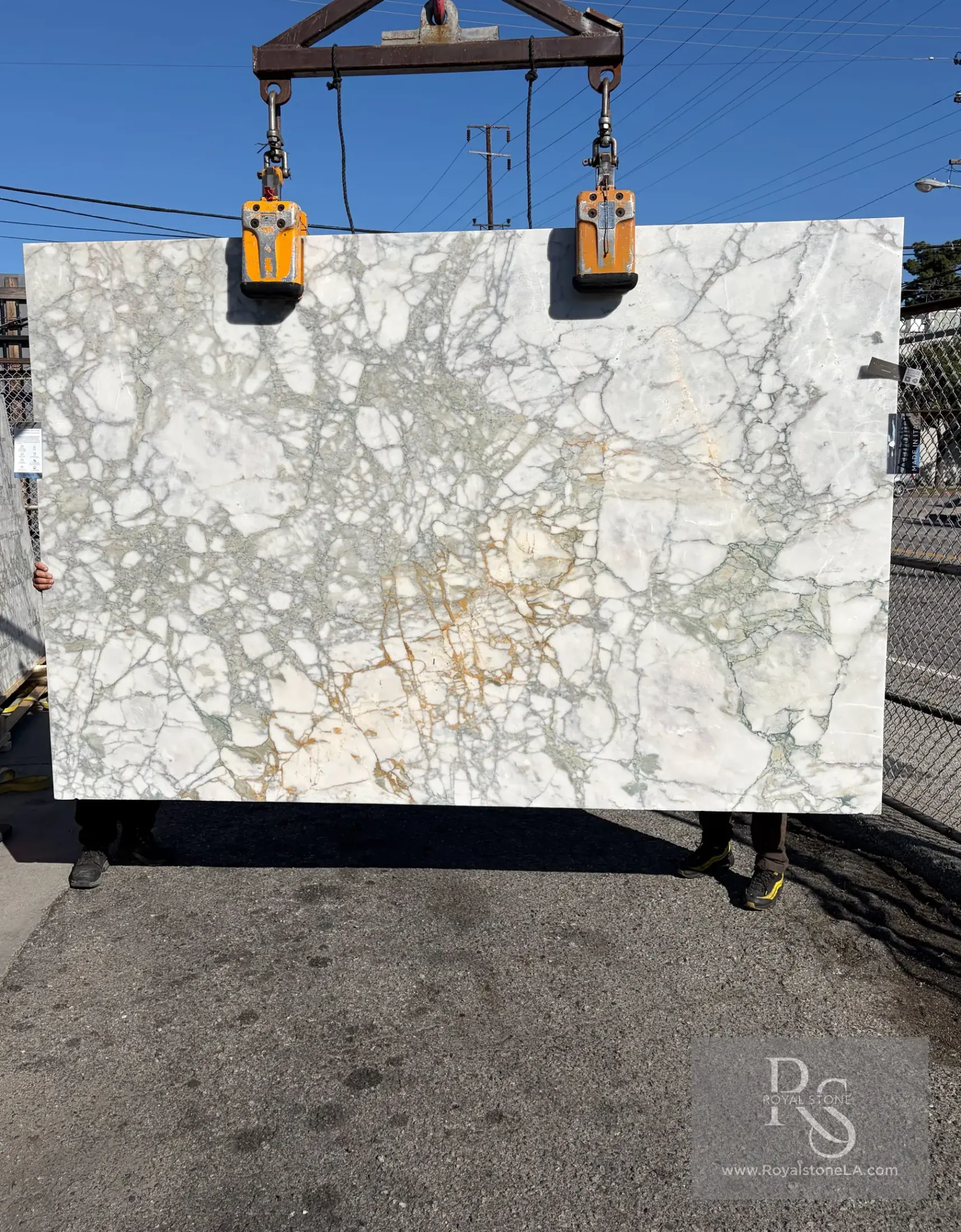 Antolini Calacatta Monet Verde honed marble slab with soft white, pale green mineral, and golden crystalline structures
