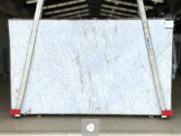 Antolini Cristallo Traslux Classic quartzite slab with near-clear translucent white field and minimal veining, polished finish
