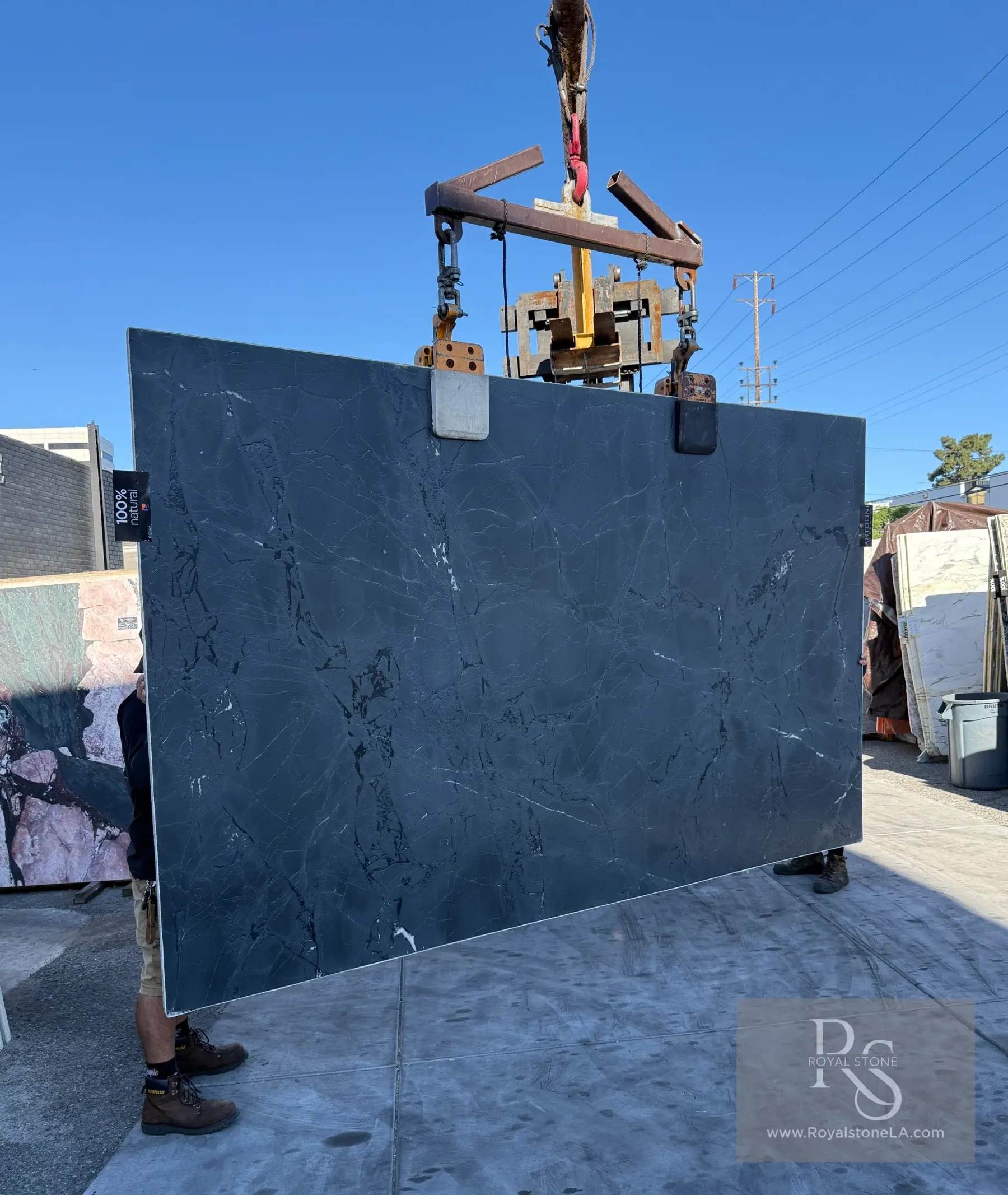 Antolini Negresco leathered quartzite slab at Royal Stone, near-black field with faint gold and gray undertones