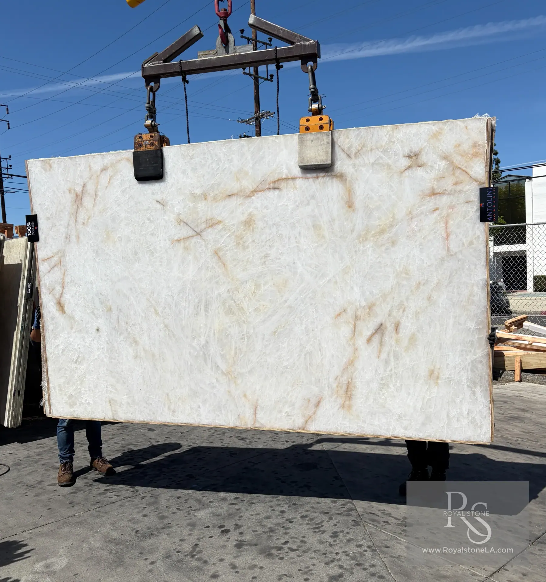 Antolini Cristallo Bianco Selected honed quartzite slab at Royal Stone, luminous white-cream field with subtle gold veining
