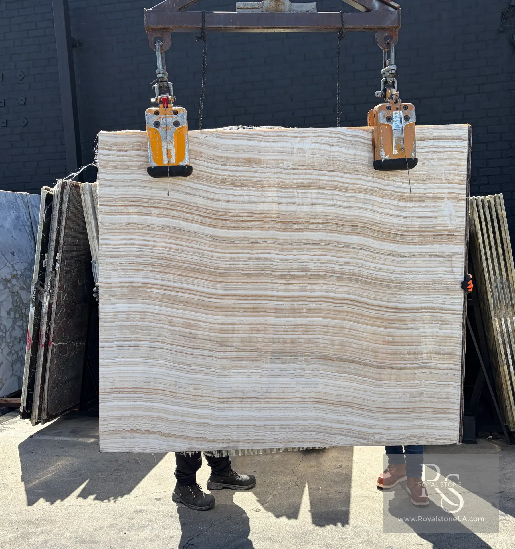Bianco Ivory Linear onyx slab at Royal Stone, soft white-to-ivory field with fine horizontal banding