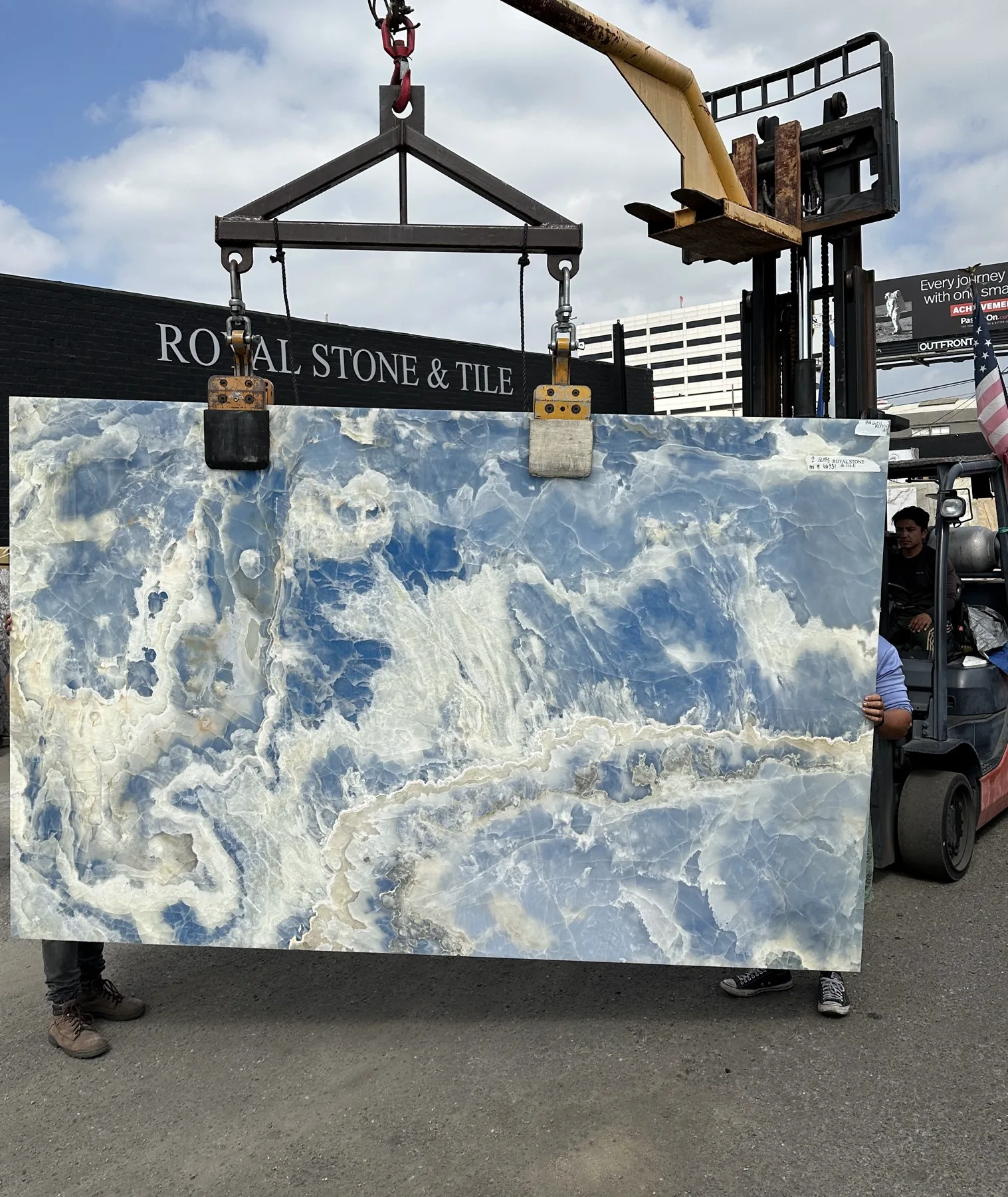 Blue Onyx slab polished at Royal Stone Los Angeles, cool glacial-blue and slate body with translucent white veining