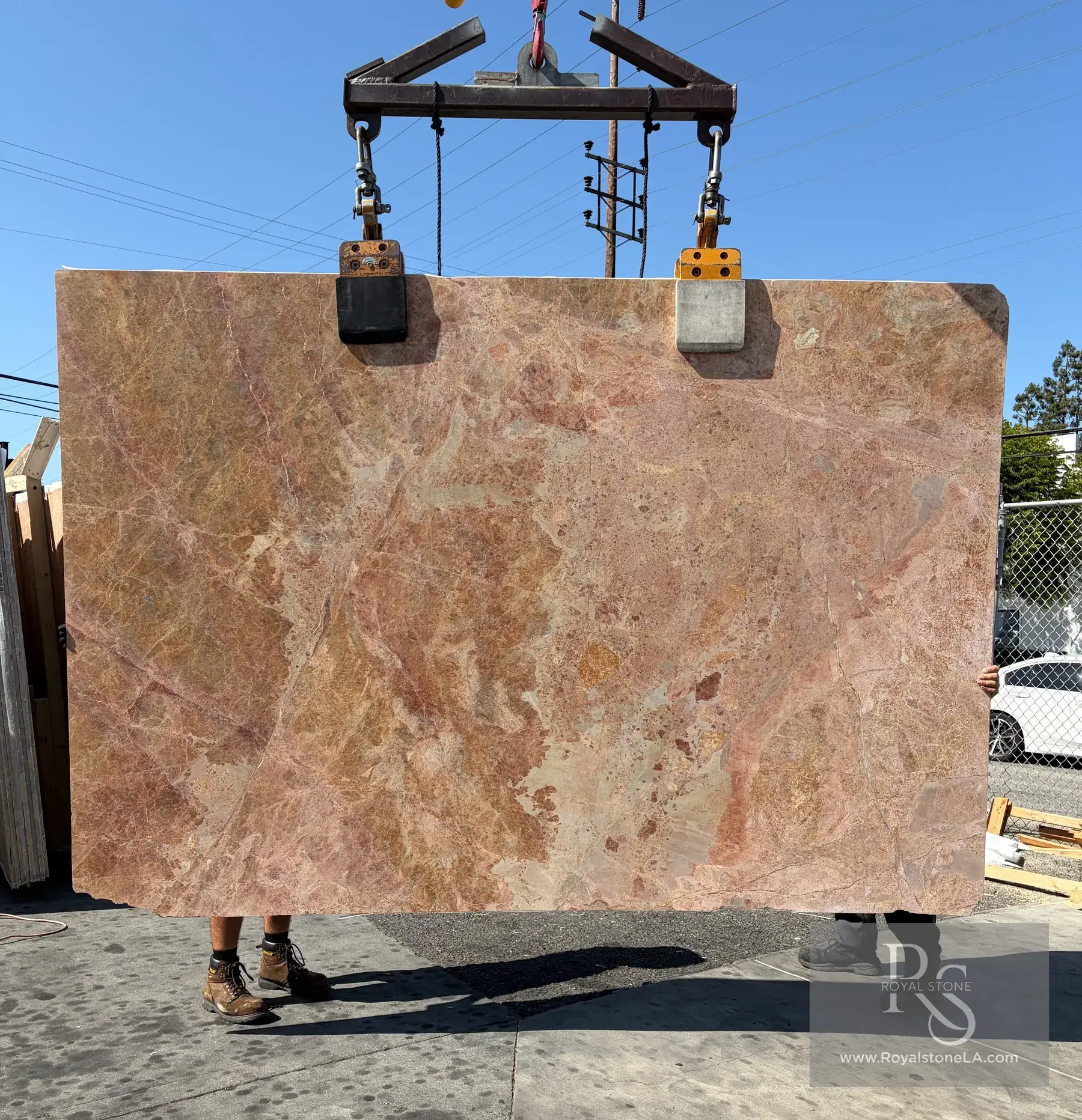 Breccia Pernice honed marble slab at Royal Stone, warm honey ground with sienna and burgundy fragments