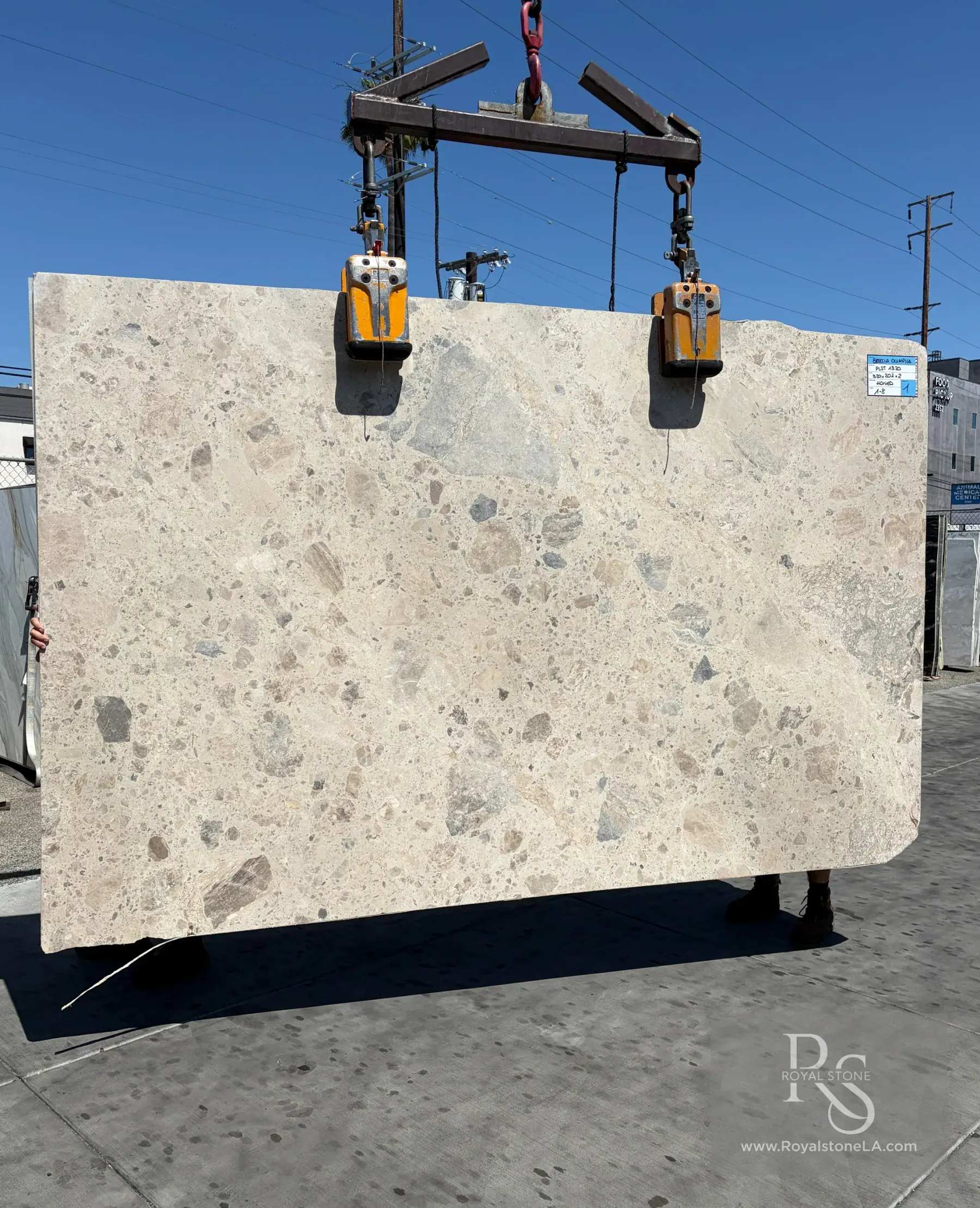 Ceppo Breccia Olympia honed marble slab at Royal Stone, warm ivory ground with layered taupe and gray fragments