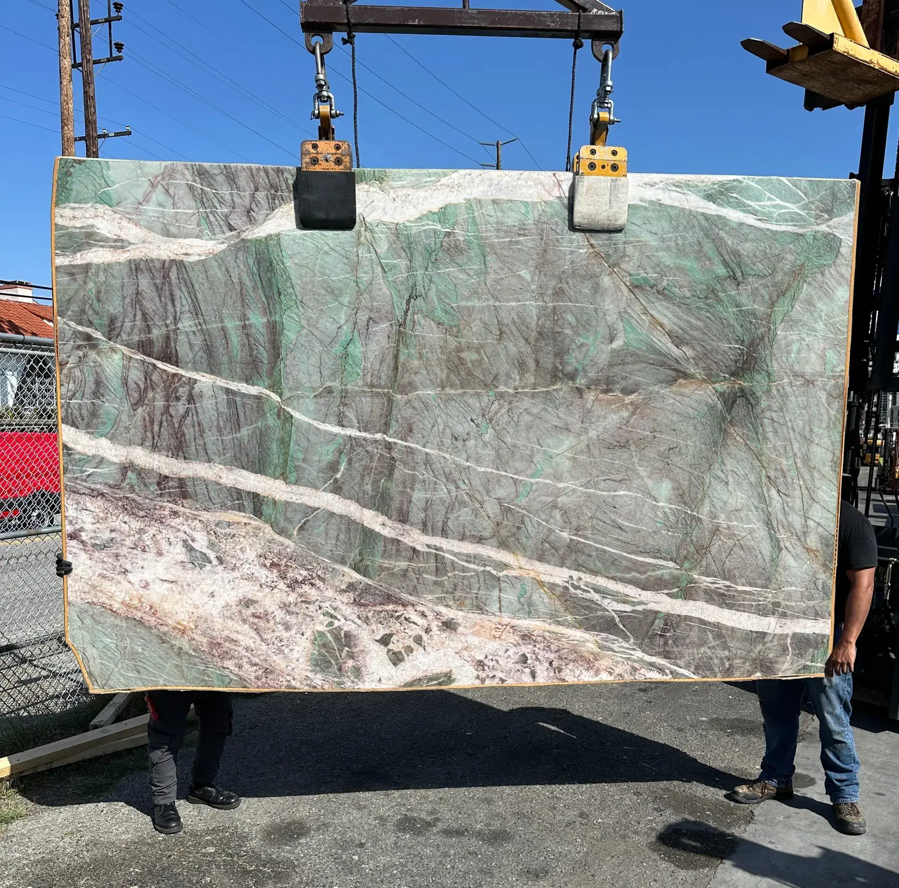 Cristallo Emerald Verde Patagonia Amazzonite quartzite slab on the crane, emerald and jade field with ivory crystal veining, polished finish