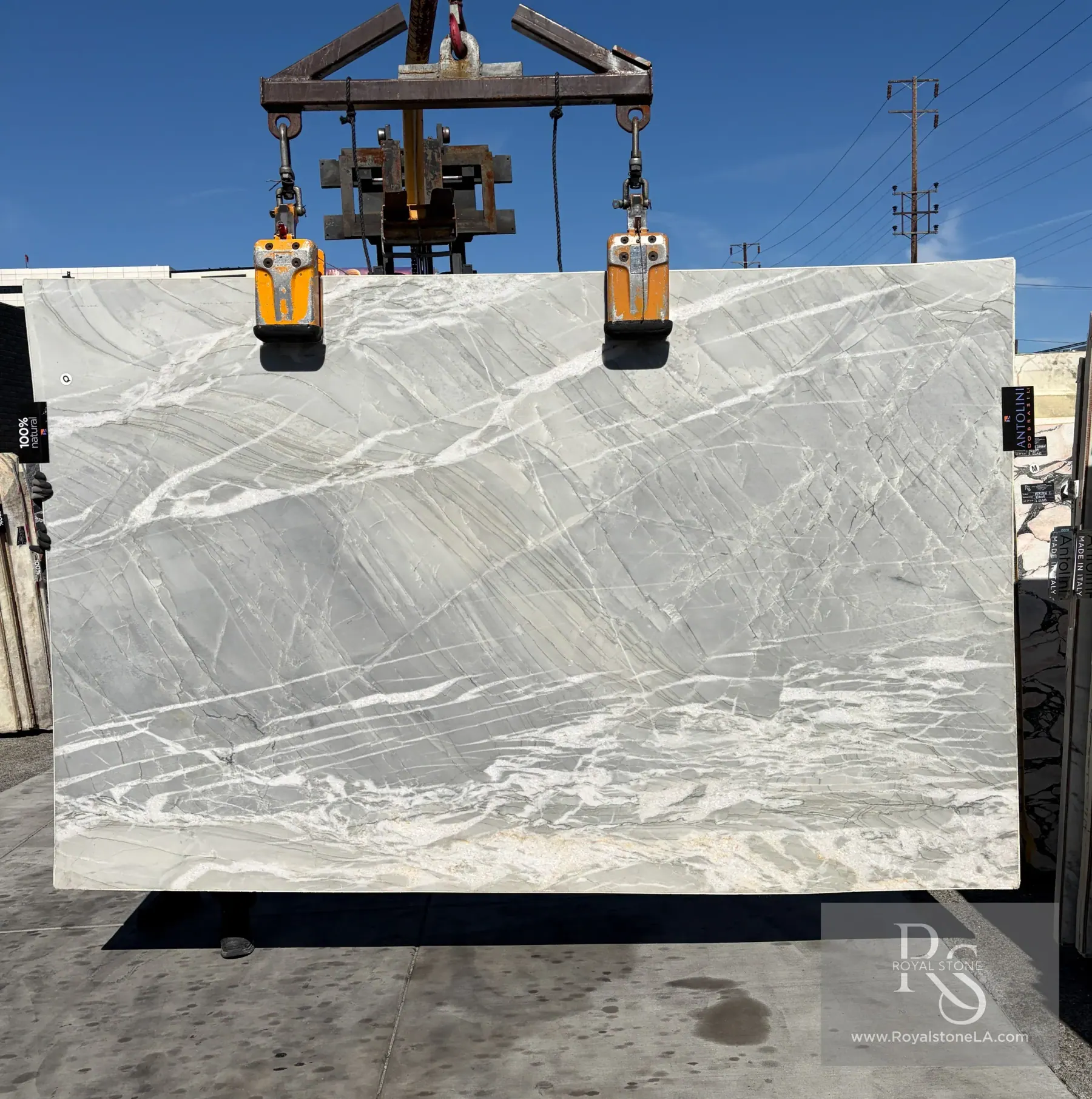 Gabana quartzite slab at Royal Stone, layered gray banding with white and gold veining