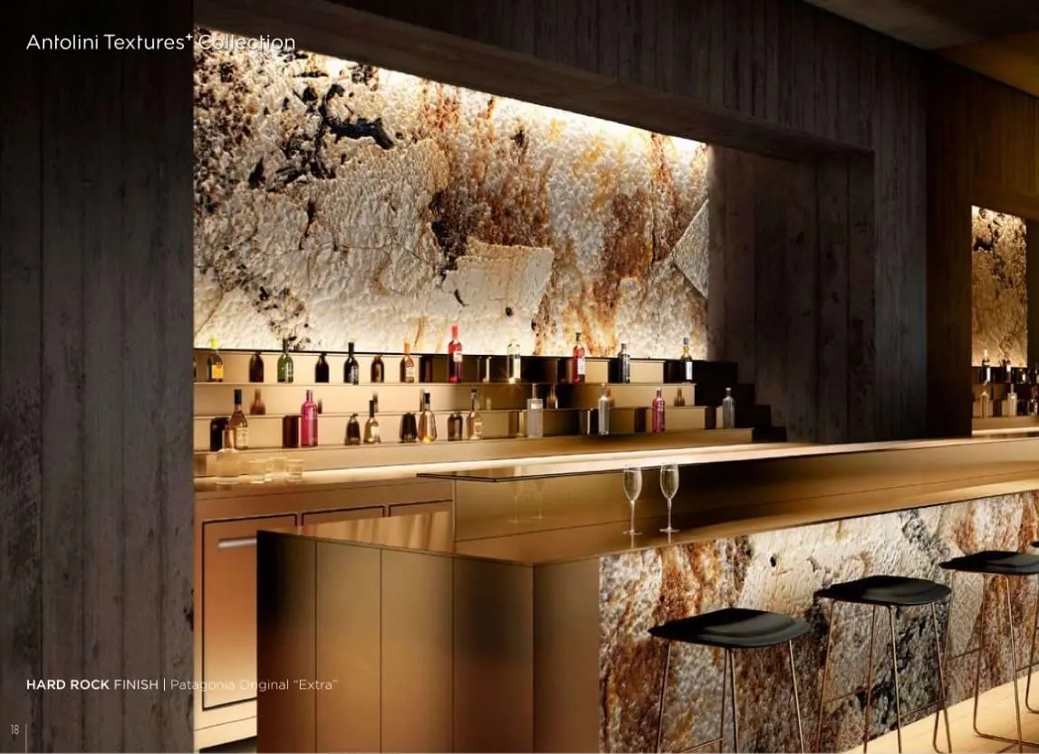 Backlit Patagonia Original Hard Rock finish slab installed as a bar wall, Antolini Textures Collection reference