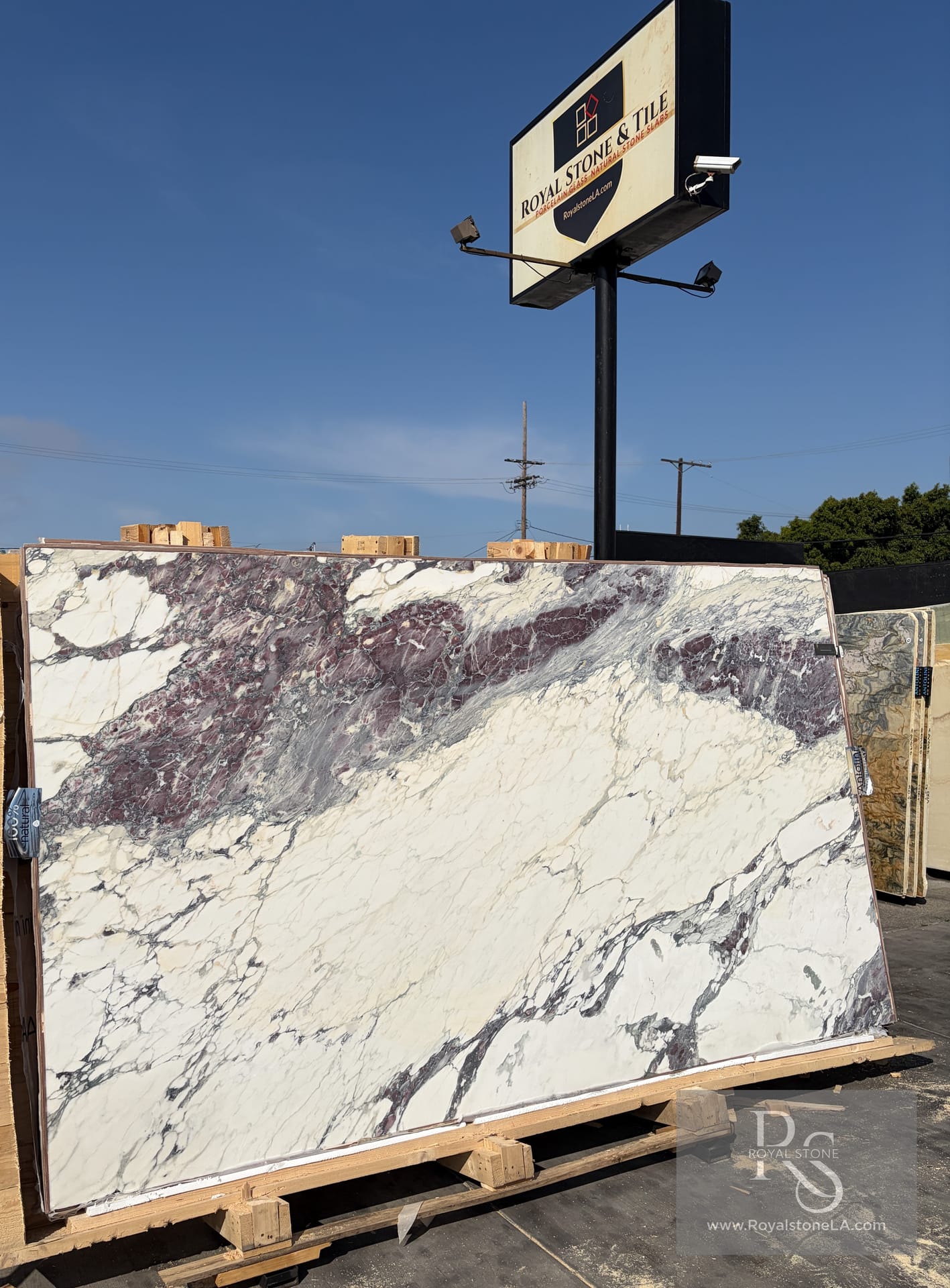 Antolini Breccia Capraia Ultimate YG557 honed marble slab at Royal Stone, white field with burgundy and violet brecciated veining