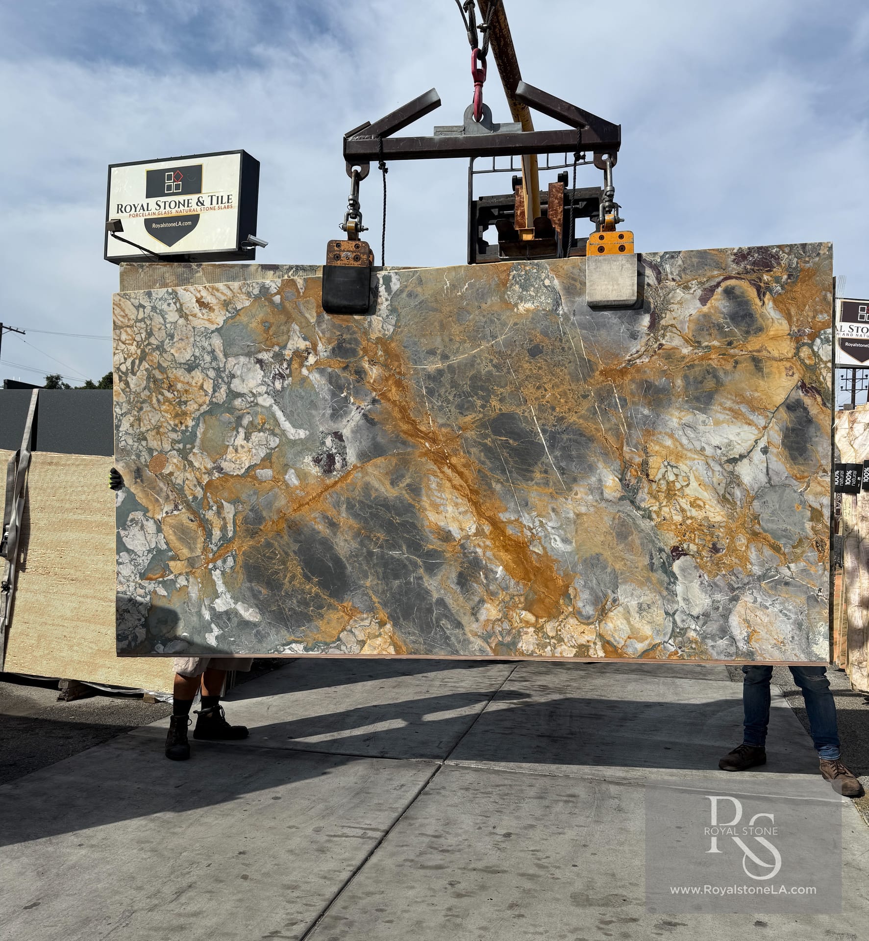 Antolini Brèche de Vendôme honed marble slab at Royal Stone, dark gray field with golden amber veining