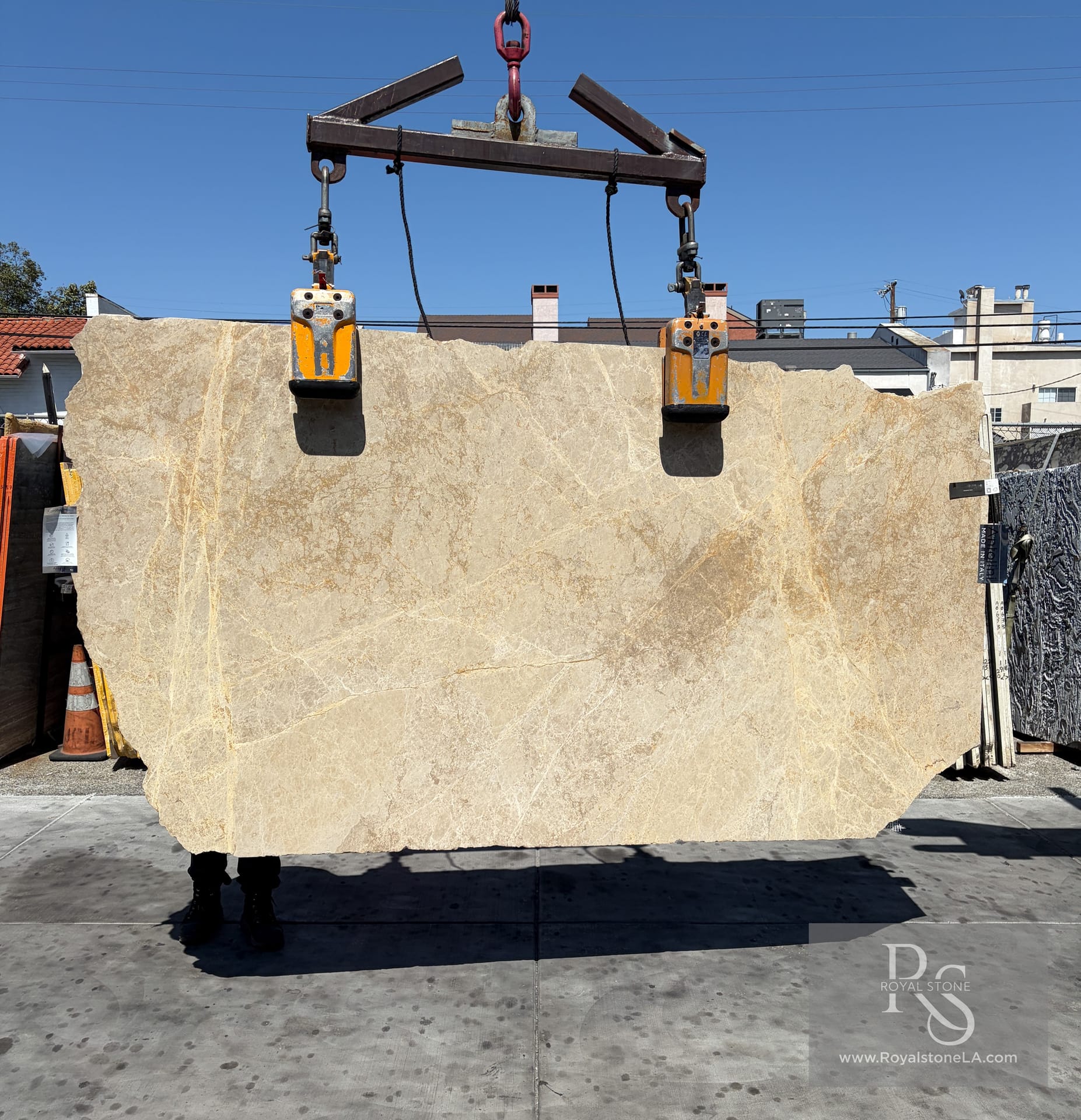 Antolini Emperador Light honed marble slab at Royal Stone, creamy beige field with soft taupe veining