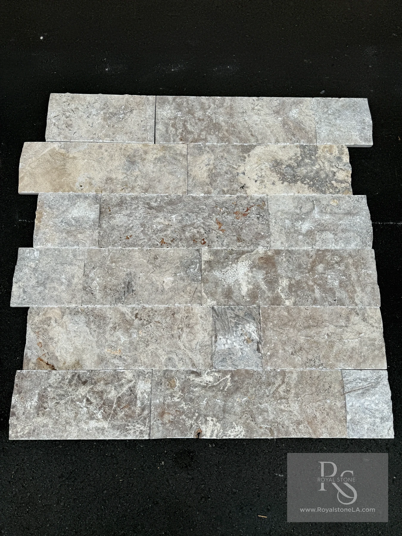 Silver Travertine 8-inch free-length split-face stone laid in a running-bond pattern