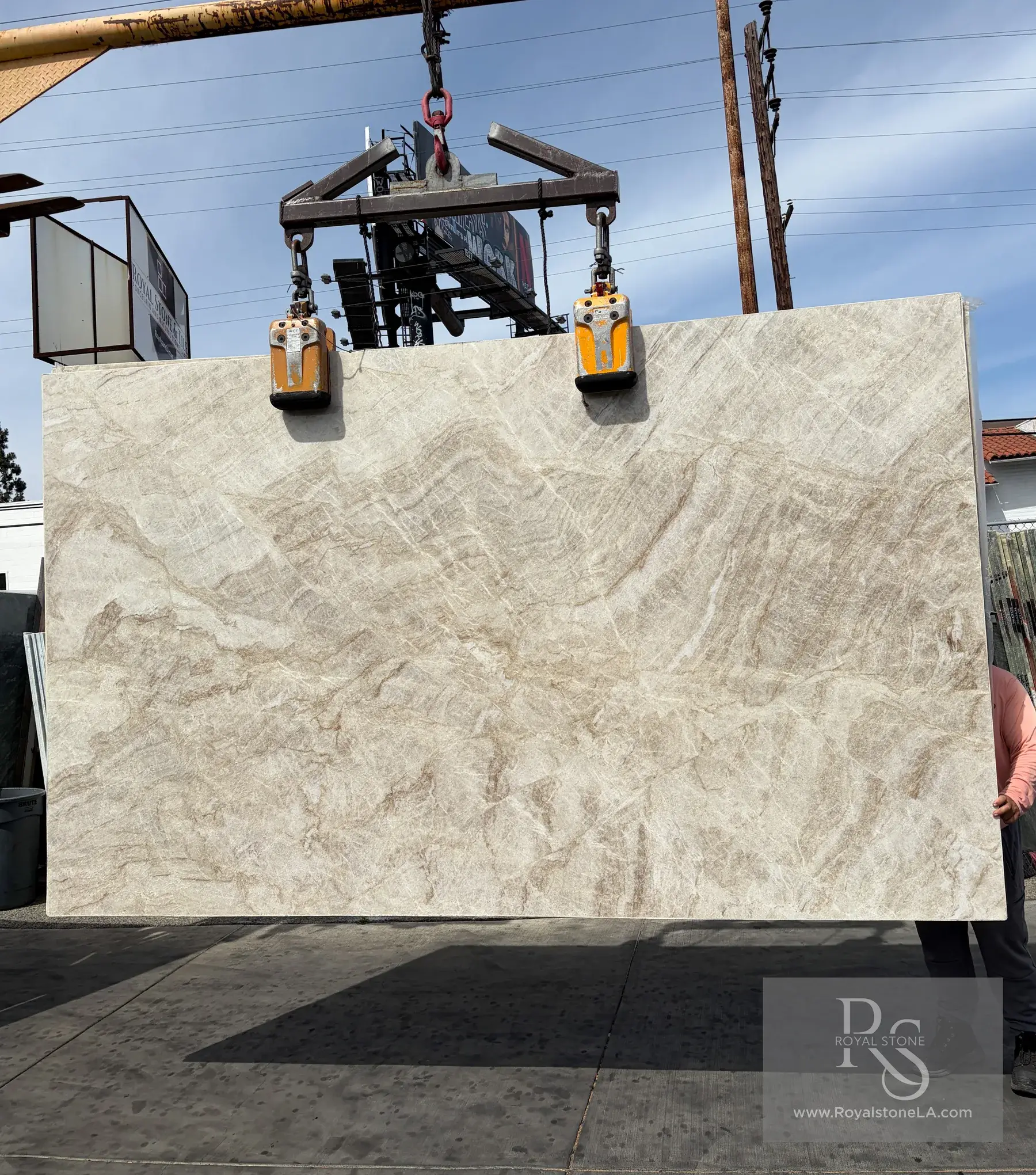 Taj Mahal Select polished quartzite slab at Royal Stone, warm ivory field with low fawn drift, 78 by 130 inches