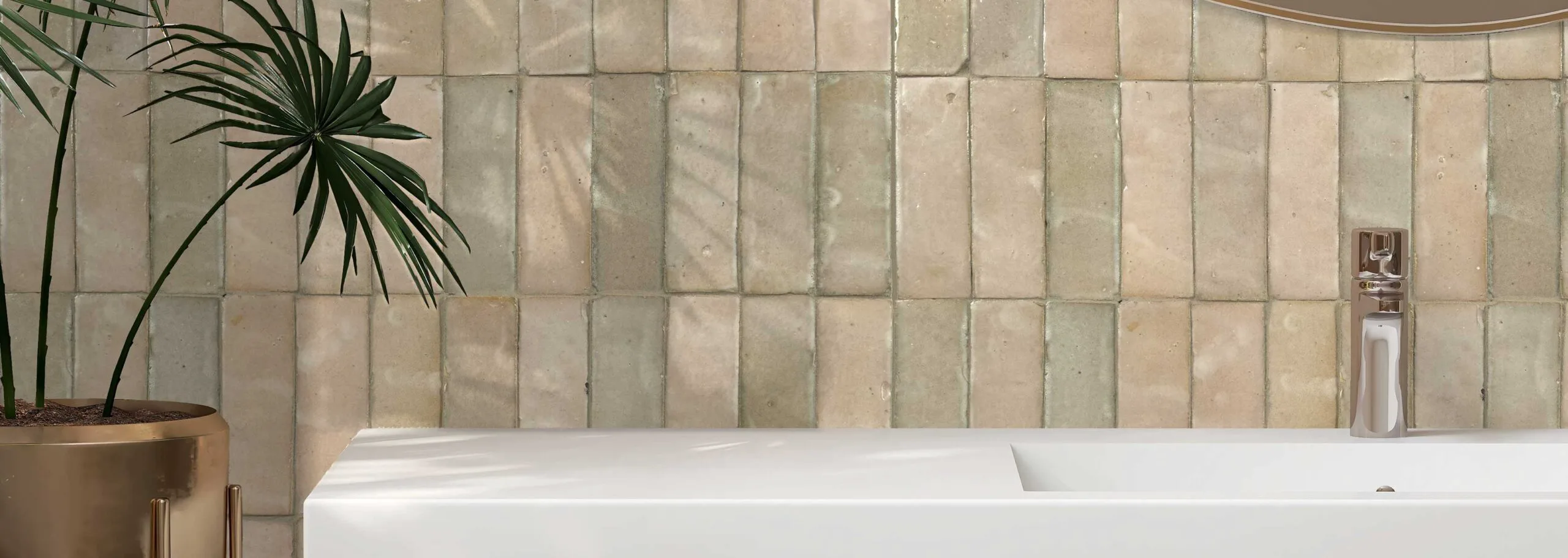 Wide view of a Zellige Classique tiled bathroom, walls and floor unified in soft glaze variations